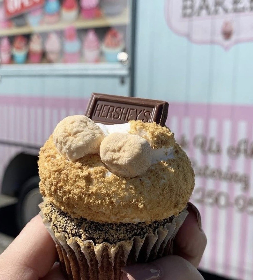 S’mores cupcake topped with toasted marshmallow and chocolate